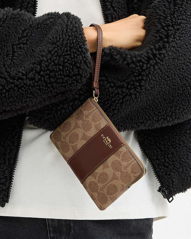 Coach Zip Wristlet In Signature Canvas With Brown Stripe